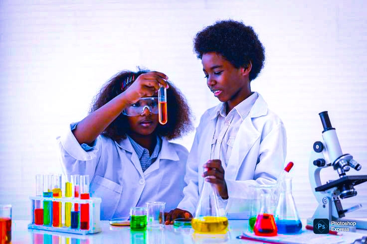 Myfin School learners in lab coats conducting a science experiment with test tubes and a microscope