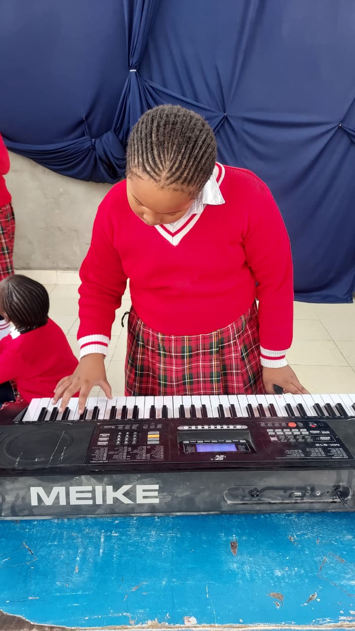 Myfin School learner playing the keyboard piano during a music lesson